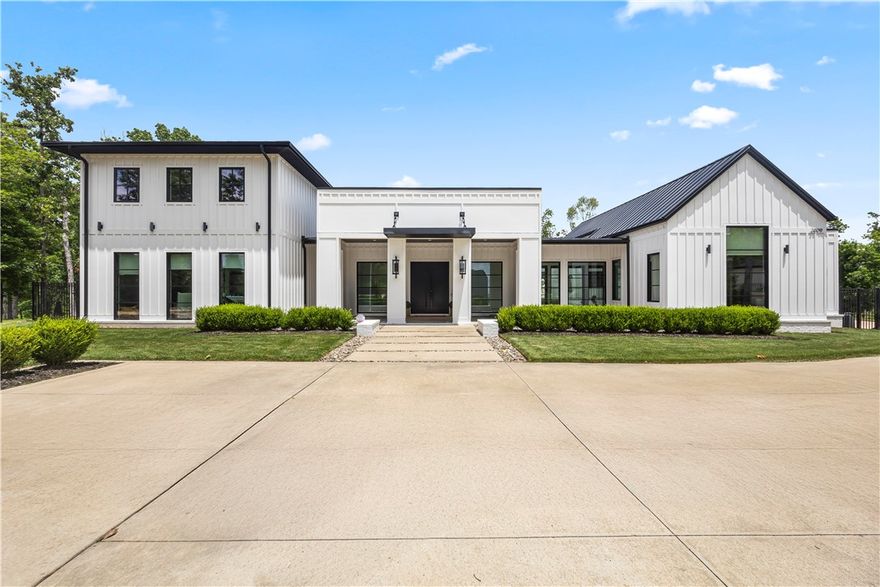 Rare 3.5-acre flat private custom-built modern home at cul-de-sac end in exclusive Copper Ridge Estates! Brand-new heated saltwater gunite pool+spa w/ waterfall, jets, lights & auto cover. Top Bentonville schools, ~5 min to Walmart HO & freeway (never traffic).

Mostly single-level w/ separate adult/kids wings.  Soaring ceilings throughout, extra-wide hallways, allergy friendly concrete floors, imported Italian marble, live-edge bench, pocket doors & built-ins galore. 4B/4.5B+huge pantry+mudroom+playroom+theater+many flex rooms. Detached ADU: bunkbeds, full bath, pro office setup. 

Resort backyard: pool+spa, artificial turf, direct access to trail w/ creek, smart speakers/lights/cameras, lit basketball court, treehouse, playground, firepit. Fully iron fenced w/ auto car gate.

Detached 4-car garage: epoxy, Tesla charger, shelves.

Other upgrades: Tornado shelter, tankless HWH, spray foam insulation, full-house UniFi WiFi, Nest CO detectors, 4x4 framing, gas lanterns, standing-seam metal roof throughout.