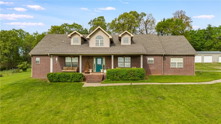 Welcome Home! Enjoy priceless views from this Beautiful hilltop home. 

Enjoy your coffee from the front porch, watching the sunrise over the valley, as the deer play and walk through the yard. Surrounded by tree line, the property is secluded and tucked away, creating ultimate privacy. Minutes from Tontitown, Fayetteville, Springdale and I540.
Plenty of room for horses/livestock as well. Approximately 2.5 acres currently fenced as pasture, add more fencing to expand as desired.

Full brick, one story with split floor plan. New Granite in kitchen and ceramic woodgrain plank throughout. Wood burning fireplace w/insert. 16x24x42 salt water pool w/diving board, adrenaline slide and LED lighting. 30x36 partially insulated metal shop building.

Driveway was a bit washed out from recent torrential rains.. 
****$10K buyers concession for driveway improvements****