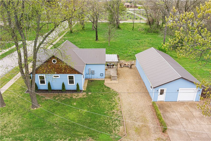 Amazing opportunity to not only purchase an existing income producing property but also develop the land behind it. Home was renovated in 22 painted exterior, added another bathroom for primary bedroom as well as stairs up to loft that can be used as a office or 4th bedroom. Truly a one-of-a-kind modern cottage. This opportunity is perfect for someone who wants to come and go and keep as a rental or live here build then sell when new home is finished. Existing detached garage is HUGE with bonus space behind could be renovated to a cool apartment or tear down to build your dream home. Make plans to see between the guests that stay and love this place!!!! Walkable to everything downtown and easy trail access makes this home perfect for rental income opportunities. Also see listing MLS # 1305569 home only and .11 acres offered.