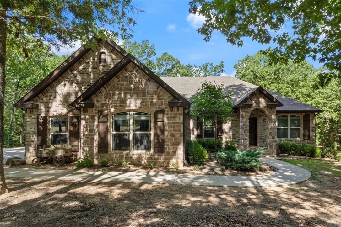 Beautifully designed 4-bed, 2.5-bath home on nearly 5 acres blends comfort, style and functionality. Enjoy an open-concept kitchen and living areaāperfect for entertaining or relaxing with family. The eat-in kitchen offers granite counters, abundant cabinetry, double oven and a spacious pantry for all your culinary needs. The inviting living room features a cozy fireplace & built-in speakers that extend to the exterior of the home, creating a seamless indoor-outdoor experience. A large mud/laundry room, complete with a second pantry, provide extra storage and organization. The primary suite boasts a walk-in closet, luxurious bath with a walk-in shower, and soaking tub for ultimate relaxation. Step onto the covered porch with a wood-burning fireplaceāideal for cool evenings or watching TV outdoors. Enjoy the tranquil sounds of the creek, plus a chicken coop, animal pen, tree stands, carport, firepit and a fenced yard ready for pets or kids. This home perfectly balances modern amenities with peaceful outdoor living.