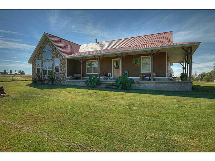 6 ponds, dairy brn, horse brn 2 tack & bathrm, hay brn, 2 chicken hses (1 operational), 1 bed cabin, all w/elec and water, shop wired w/220, gen purpose brn w/elect, corrals w/head chute, pole barn, hay barn w/ elec, holds over 400 bales,rodeo arena w/7 lights, press box, running/roping chutes, pavilion, pond w/waterfall, garage attic is floored w/ stairs, covered patio behind garage. Wood burning cook stove does not convey.