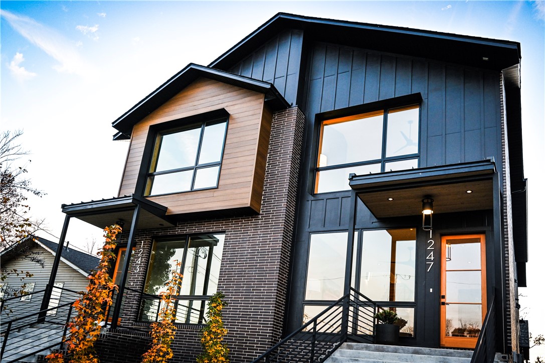 Modern design meets downtown convenience in this stylish 3 bedroom, 3.5 bathroom townhome in the heart of Bentonville. The functional floor plan includes a bedroom on the first floor, offering flexibility for guests or multi-generational living. This residence features open living spaces, high-end modern finishes, quartz counters, and abundant natural light throughout. A 1-car garage provides private parking and additional storage—an uncommon amenity for downtown. Perfectly located near trails, Crystal Bridges Museum of American Art, and the Downtown Square, this home offers a rare opportunity to enjoy the walkable and bikeable Bentonville lifestyle.
