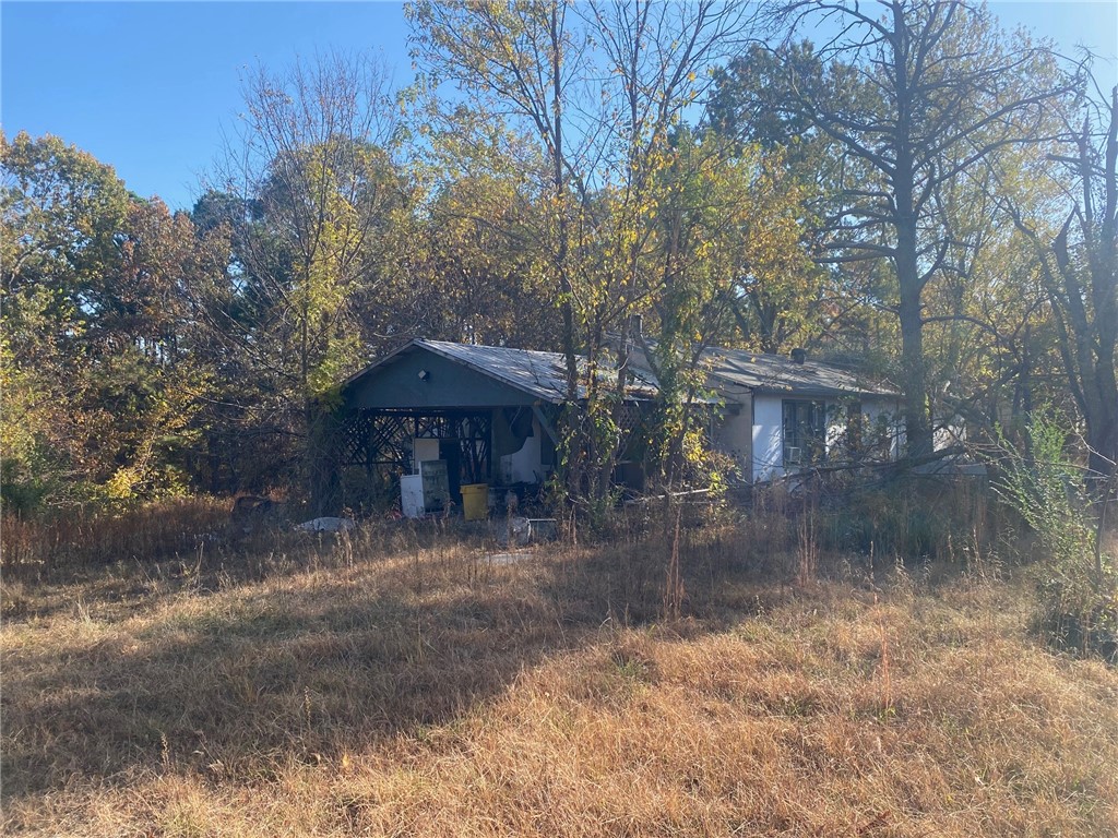 Private 5-acre track with a home place located in a secluded setting. There is a well and septic that exist on the property. The property has roads on 3 sides. Located close to Hobbs State. Great opportunity to build a cabin or your next home. House on property is conveyed at no value.