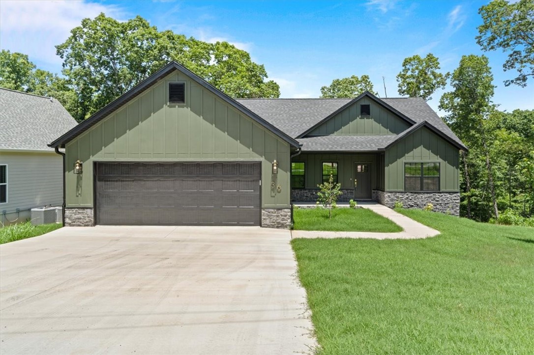 Welcome to your new dream home located on a gently sloping walkable lot. The builder was very meticulous about finishes and the homes split lay out with the primary on one side and the guest rooms on the other side with a half bath in the middle for entertaining guests. Speaking of entertaining the large12ft by 30ft deck is another custom addition that sets this home apart from the rest. The back porch is accessible from the open kitchen and the primary suite. Special attention was given to the primary bathroom with a deep soaking tub, walk in shower and a bonus make-up vanity area. The living room is highlighted by the 5 foot linear electric fireplace and custom bookshelf. The kitchen has a built in microwave drawer, GE energy star dishwasher and GE energy star electric convection range with air fry option.