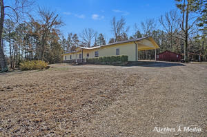Peaceful Retreat....Come and enjoy the peace and quiet just a few minutes outside of town! This home features three bedrooms, two bathrooms, a cozy open floor plan with an eat in kitchen that offers plenty of space for all guests. The peaceful outside boasts additional space for gatherings along with additional storage.