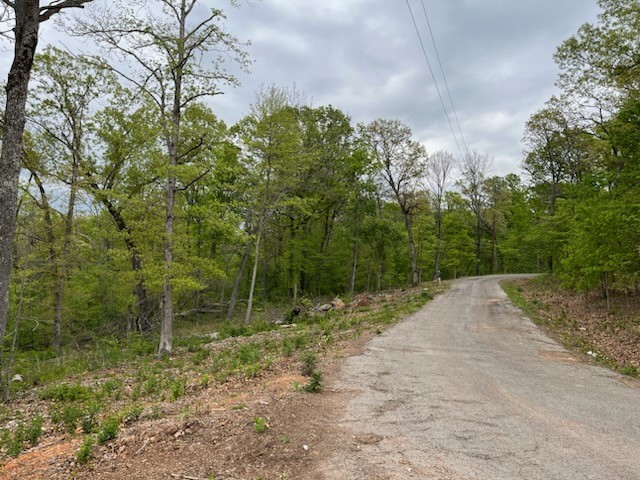 Beautiful hard to find 1.99(+/-) acre lot situated in quiet cul-de-sac close to Branchwood Rec Center. Trails and very convenient to bypass access. Perked for a 4-bedroom home with topography survey and septic design already drawn. Enjoy amenities Bella Vista POA has to offer bike trails, multiple golf courses, lakes, gyms, etc.