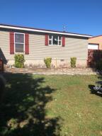 Country home with large shop ( 40 x 60 ) on 1.23 acres more or less. Home is a 3 bed 2 bath home with front and back decks. Home will need some TLC (like new floor coverings and paint.) Shop has high ceiling with three large bay doors. Property is located in a country setting with fence surrounding entire property. (Pool will require some repairs.)
