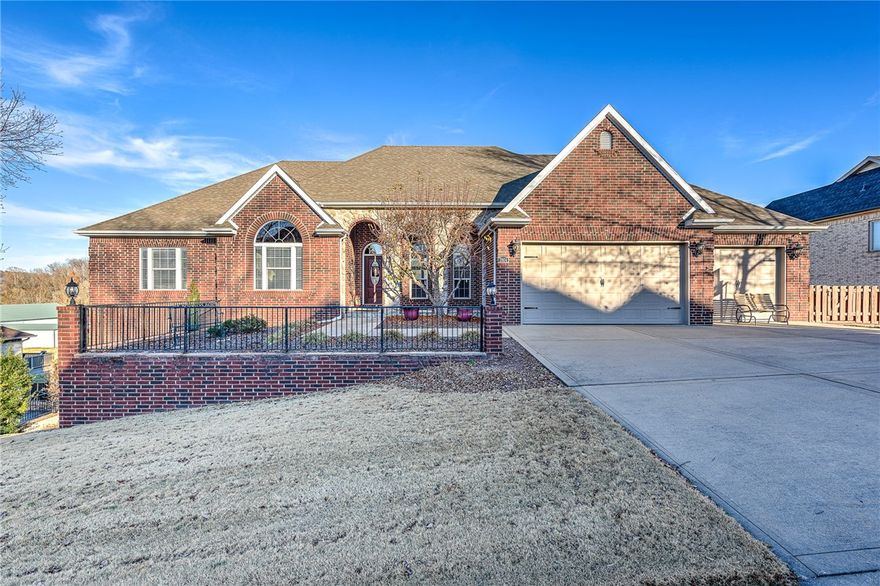 Wonderfully spacious 4 bed/3.5 bath home with beautiful scenic back views in desirable North Bentonville just minutes to downtown Bentonville, I-49, trails and more! Fully fenced yard with fabulous outdoor living spaces all in a peaceful and tranquil setting. Inside this well-loved home, you will find multiple living spaces ideal for entertaining large & small groups! Main level hosts a formal dining boasting 12’ ceilings, formal living, private office, guest bedroom, spacious eat-in kitchen w/ large island that opens to a cozy hearth room, luxurious 28 x 15 primary suite w/ dual sided fireplace and sitting room plus updated en suite bath! Amazing walk-out basement hosts 2 bedrooms, family room w/ fireplace, game room, kitchenette, media room, bonus room, full bath & fabulous walk-in storage space! Solid wood flooring, granite throughout, 2 new water heaters, central vac, 3 car garage w/ great storage, basement washer/dryer hookup/second laundry! This home offers the ideal blend of tranquility and convenience!