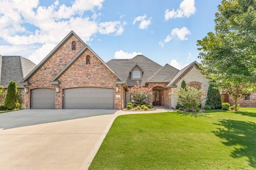 GORGEOUS Woods Creek Home w/all the Bells & Whistles! Highly sought-after neighborhood w/great amenities and amazing location w/easy access to I-49 & Downtown Bentonville. Fantastic floorplan, all bedrooms on main and media room w/full bath upstairs! Open Living layout w/formal dining, living room & eat-in kitchen. Living room has massive windows looking out to private yard, beautiful vaulted ceiling w/wood beams & stone fireplace w/built-ins. Large kitchen has built-ins, gas range w/pot-filler, island, pantry & more! Large master suite is a true retreat w/attached bath boasting double vanities & abundant storage, tiled walk-in shower & soaking tub. Office w/gorgeous woodworking, beams & built-ins. Mudroom & Laundry. 2 Guest Bedrooms with J&J bath and 3rd guest bedroom & bath. Media room has a wet bar & full bath. Smart home with connections to irrigation, auto shade, nest thermostat, doorbell & security cameras and more. Huge .66 Acre lot w/privacy fencing and covered patio for outdoor living. This is a MUST SEE!