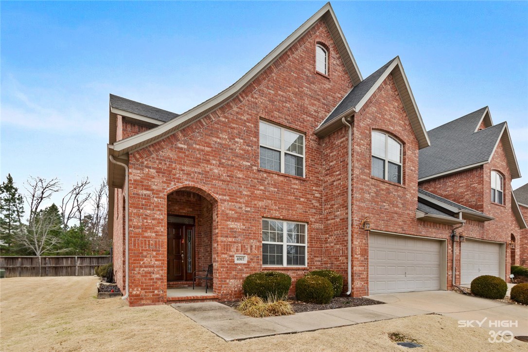 *VERY WELL MAINTAINED, CLASSIC BRICK CONDO WITH INVITING ENTRY AND AMENITIES* Open flow kitchen, dining, and living areas plus breakfast bar. Tons of natural lighting enters through dining and living areas. Living room boasts high ceilings and gas log fireplace that could be converted to real wood burning. Master bedroom and bath are downstairs down a hallway away from main living areas. Master bath contains soaking tub, stand-up shower with floor to ceiling tile, his and hers sinks, walk-in closet with shelving, and separate toilet area with door for extra privacy. Extra bathrooms complete with tub/shower combo plus convenient half bath. Laundry room/mud room entrance from garage has room for washer and dryer plus its’ own sink. Backyard is complete with stone lay patio perfect for dining and enjoying time outside. Home includes frequent landscaping, mowing, planting, plus access to pool and clubhouse. This is an extremely well maintained condominium with great amenities conveniently located off Joyce Blvd.