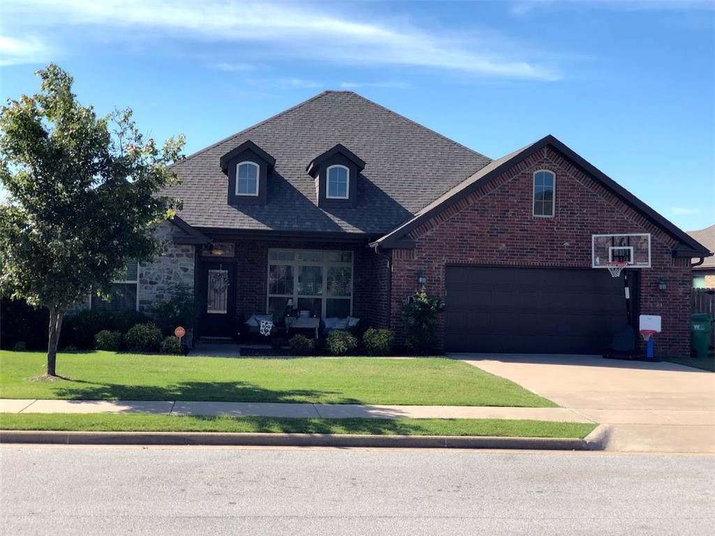 4 bed/2 bath all brick home next to Shaw Elementary, Shaw Family Park, Fire Station #9, and a couple minutes from 612 Bypass. You can be to Rogers in 10min and Fayetteville in 15min. All bermuda yard with irrigation. Front and back professionally landscaped. 2 car garage. Covered front and back porches. Eat-in-kitchen and formal dining room. Large island w/ bar. Mostly engineered hardwood floors throughout w/ tile in kitchen and bathrooms. Large walk-in closet in master w/ carpet. Walk-in shower and separate whirlpool tub. Security System equipment conveys. Neighborhood Pool and Clubhouse.