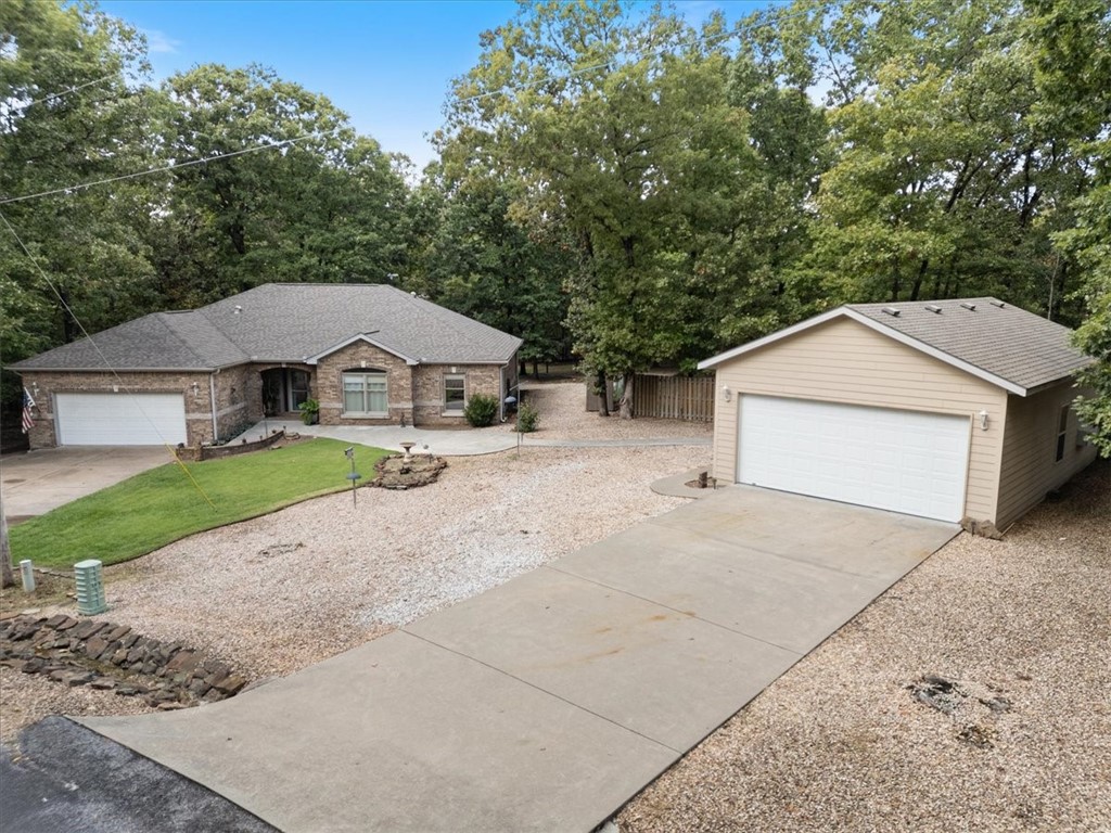 This beautifully maintained 3-bedroom, 2-bath home, built in 1994, offers timeless charm with modern updates. The open floor plan is designed for both comfort and functionality, featuring a large living area with gas log fireplace that flows seamlessly into the kitchen and dining spaces.
The kitchen is equipped with solid surface countertops and ample cabinetry, perfect for everyday cooking and entertaining. Luxury vinyl flooring runs throughout the home, providing both durability and style. A sunroom at the back of the house invites natural light and makes the perfect spot to relax year-round.
Sitting on a .65 acre park like level lot, the property also boasts a massive 750-square-foot detached shop—ideal for hobbies, storage, or a home-based business. The all-brick exterior offers low-maintenance living, while recent updates include a roof just 3 years old and a brand-new HVAC system (2025), ensuring peace of mind.
Close to the Branchwood Rec Center, Golf and Loch Lomond lake. Easy to the bypass!