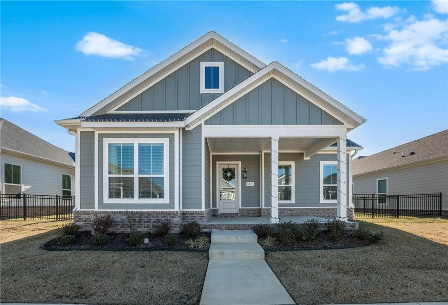 Built in 2024, this modern cottage-style 3-bed, 2-bath home blends comfort and convenience in an ideal location next to Shaw Park and minutes from shopping, the Rogers Promenade, and XNA. An open layout with a cathedral ceiling and striking 11' glass doors fills the home with light and leads to an extended covered patio perfect for relaxing or entertaining. The kitchen shines with quartz countertops, luxury vinyl floors, and upgraded ceiling-height cabinetry. A mud room/laundry combo adds everyday ease, and the extended 2-car garage with epoxy flooring offers great storage. With lawn care and irrigation included through the POA, access to a community pool, plus a reservable pool house for any event, you get low-maintenance living in a peaceful spot that’s still close to everything. Nest doorbell and large appliances will not convey with the home.