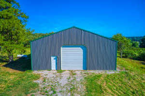 What a unique place! An amazing insulated-concrete floor 40X40 shop building with living quarters! Finished 2 bedroom 1 bath home in the back of the shop. The open concept kitchen has beautiful wood cabinets with lots of storage and beautiful tile work! You'll love the view and the quiet location. This property is close to Alpena, Harrison AND Green Forest. The property is fenced and cross fenced and has a pond. The perfect set up to live on the property while you build your dream home! Call me today!