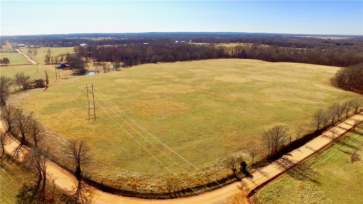 If your looking for an opportunity to own pristine land with superior development potential this
Benton County farm has it all. The property is 36 acres in total and being split into two parcels
of 25.569 acres and 10.685 acres. The 10 acre parcel is fenced on two side and fronted by
Fishback Rd and Fruitwood Rd., with rural water/electricity at the road. With the property being
mostly pasture it’s beautifully accented a few mature trees and neighboring timber. When it
comes to location this property is only 1 Mile from AR-279,10 miles to XNA Airport and 10
miles to Downtown Bentonville, Ar.. While on the property, I noticed several signs of wildlife, to
include deer heavily traveling from one block of timber to the next.