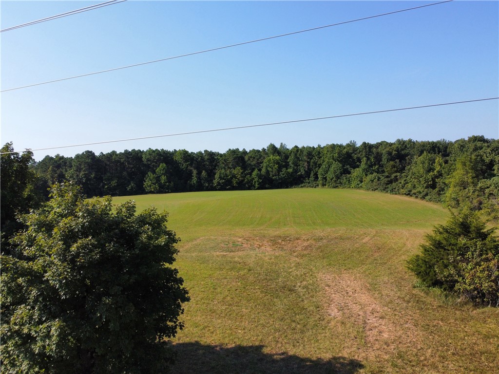 4.64 acres of flat/level cleared land with Hwy 7 frontage in beautiful Newton county Arkansas. Endless possibilities south of Jasper near hiking trails, national forest, and only 30 minutes to Jasper square.