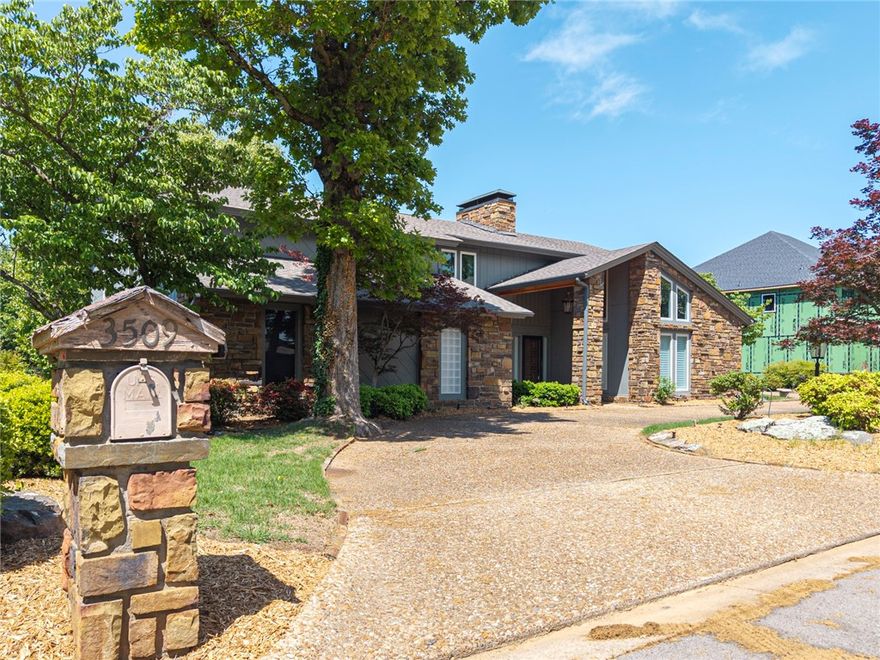 Nestled in a desirable neighborhood, this luxurious home boasts natural rock and warm wood accents for timeless elegance. Tall windows flood the space with natural light, and the front door opens to a koi pond and circle drive. The serene backyard features a deck off the kitchen, perfect for entertaining, with stunning views of Fort Smith and Oklahoma. Inside, expansive windows showcase breathtaking city skyline views and sunsets. The spacious layout includes high ceilings, elegant finishes, and seamless flow between the kitchen, formal dining, and cozy family room. The remodeled master suite features a soaking tub and picture window, offering stunning views and tranquility. Blending comfort, luxury, and serenity, this home is a true gem in an enviable location.
