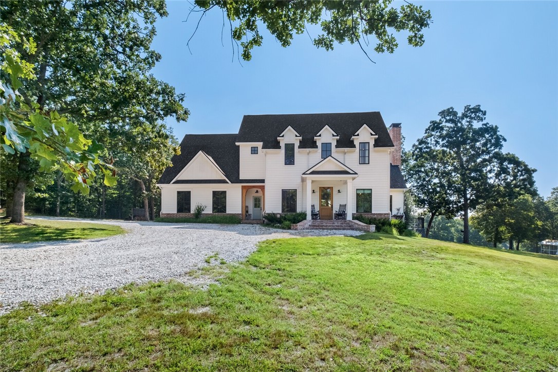 Stunning country estate featuring a 3661 square foot craftsman farmhouse sitting on 53.45 rolling acres with a fully stocked pond. Custom built in 2019 with great attention to detail, including designer lighting and smooth drywall. An abundance of natural light flows from formal dining with barn doors to living room with vaulted ceiling & wood burning fireplace. Gourmet kitchen with island & separate full pantry. Enter from friendās entry or 3 car garage into mud area with built-in cubbies & utility room with drying shelves & dutch door. Private main level primary bedroom with elegant bathroom & walk-in closet. Upstairs features 3 bedrooms, 1 ensuite bath, 1 Hollywood with double sinks, bonus room with built-ins, and attic storage. Incredible covered back porch with swing & nightly views of wildlife. New in-ground pool. Home generator, security system with cameras, central vac. Custom barn with mini split system could easily be finished for guest quarters. Additional well on property.