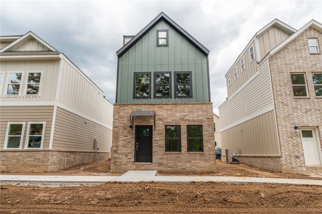 Brand new 2 BR/2 BA townhomes in south Fayetteville located close to U of A, Baum-Walker Stadium, The Ramble, Razorback Greenway, I-49, and all of Fayetteville's downtown area. This beautiful home features luxury vinyl plank throughout. The primary bedroom, kitchen and living area are on second level with the second bedroom and utility room on the first level. Kitchen has a pantry and both bedrooms have walk-in closets. Tub/shower combos in both baths. Third floor loft provides flex space. 2 car garage. Agent owned.