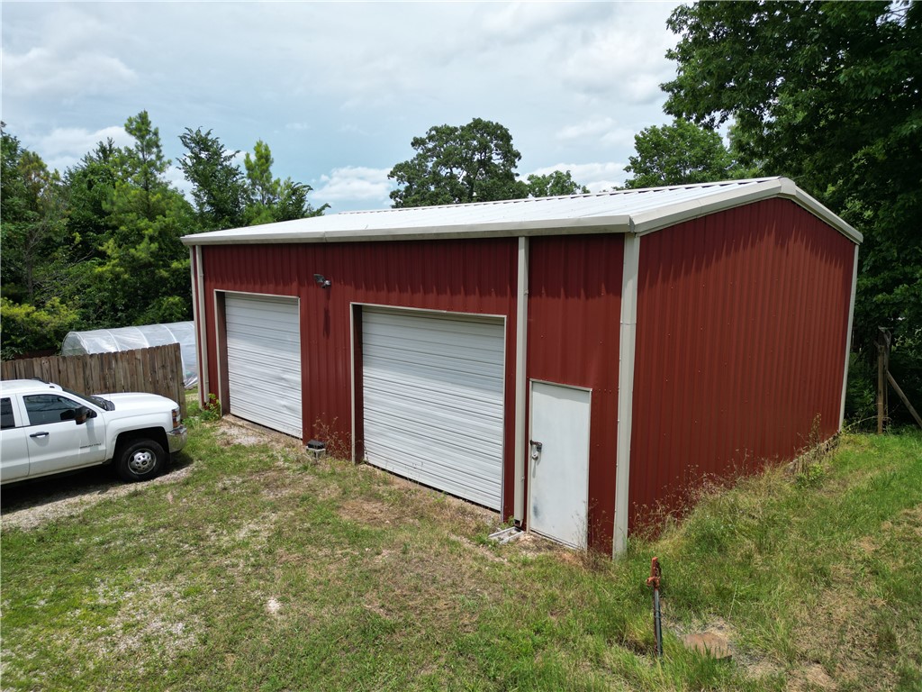 Highway Frontage with a Shop! 2.02 Acres! Hwy 71! Zoned Commercial-Multi Use. The 30 x 40 (1200 sq ft) insulated shop is constructed on a concrete slab with Red Iron support beams, Steel metal siding, metal roofing, 12' overhead doors, and currently has electric with wiring to code with 220 outlets. Shelving, Lights, and Benches convey with shop. All other items in the shop and on the property do not convey. Water and gas utilities are available. Shop does not currently have a bathroom, a septic would be required to add a bathroom. Four water spickets are available in various places on the property. Property is considered a Multi use property and can also be considered Residential, a home can be built on it as well. Partially fenced with a privacy fence.