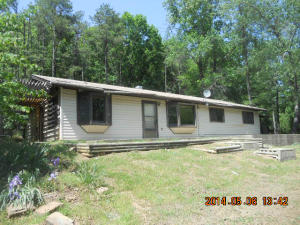 4 bedroom, 2 full bath, vinyl-sided home with deck, 4 sheds, detached 2-car carport, and is semi-secluded. Property is sold AS IS and WHERE IS with no warranties expressed or implied.
