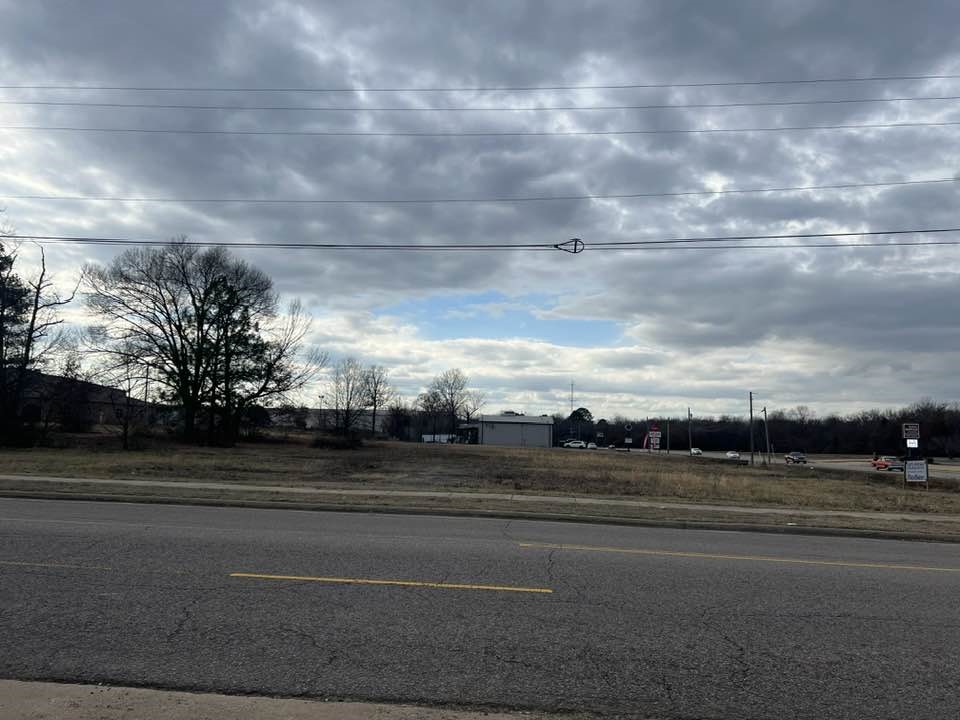 This nearly one-acre commercial lot is a rare find, ideally situated with prime frontage on a highly trafficked major road. Located in one of the most desirable and rapidly growing areas of town, this property offers unparalleled visibility and exposure to potential customers. The lot is within close proximity to major shopping centers, making it an ideal spot for retail, office, or mixed-use developments. With easy access to main roads this location promises high foot and vehicle traffic, ensuring excellent opportunities for any business.