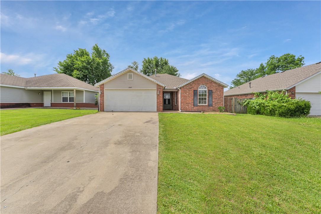 Discover comfort and convenience in this beautifully maintained 3-bedroom, 2-bath home located in the desirable Kristyl Heights Subdivision. With 1,333 square feet of thoughtfully designed living space, this home is perfect for first-time buyers, or investors seeking proximity to everything Bentonville has to offer.
Step inside to find a spacious living room with a cozy gas fireplace, low-maintenance laminate and tile flooring, and an open layout ideal for entertaining. The kitchen comes equipped with an electric range, dishwasher, and ample cabinet storage, all complemented by a convection oven for the home chef.