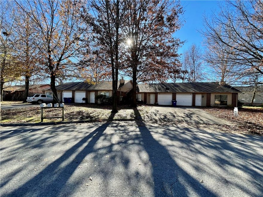 Don't miss out on this conveniently located 2 bedroom 1 bath four-plex unit.  Ceramic tile in kitchen and bath, carpet in the bedrooms, vaulted ceiling in living room, gas log fireplace and more. This property is located just minutes from Downtown Bentonville, Walmart Home Office and Crystal Bridges **Pics may not be of exact unit**
