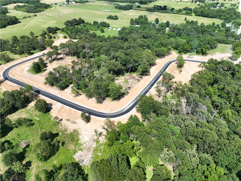 Discover the perfect setting for your dream home on these breathtaking estate lots! With paved roads, city water, and a 2,200 SF minimum, these private homesites offer a blend of luxury and tranquility. Enjoy stunning views in a prime location, providing both seclusion and convenience. Don’t miss this rare opportunity to build in a truly exceptional setting. In total there are 27 lots. Subject to final plat