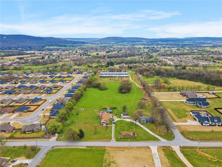 3.3 Acres m/l of open and level land waiting for the creative touch. Minutes from schools and downtown amenities. Well maintained paved road frontage. Electric, water and natural gas utilities at the street. Lot has a passing soil morphology (Perk Test). Additional adjacent acreage available if buyers prefer. Lot lines shown in pictures are estimations. Property split is pending final government approval. Also see MLS# 1338585 & 1338599