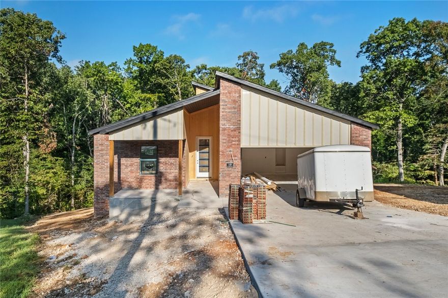 One of Bella Vista's latest new construction projects, this contemporary.  Lexus floorplan, is perfect for any lifestyle.  This home, featuring 3 bedrooms & 2 baths, all on one level w/open kitchen and living room, dedicated laundry, pantry and covered back porch w/steps down to the private backyard outlined w/natural trees, all nicely tucked away on a quiet cul-de-sac in the heart of the Highlands area Bella Vista, is one you don't want to miss out on.  Estimated completion is 10/10/25! 2 Year Builders Home Warranty!