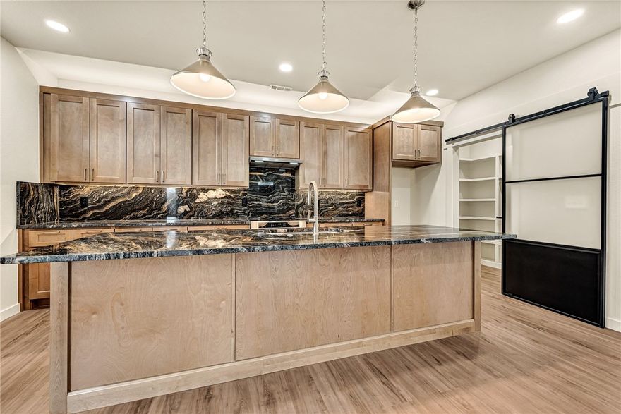 Blair Ave residence offers refined in-town living just minutes from Downtown Square, Walton Arts Center, Wilson Park, Fayetteville Public Library, and the University of Arkansas.

Interiors showcase soaring ceilings, wide-plank floors, custom millwork, and designer lighting.

Chef's kitchen features premium appliances, stone countertops, and a generous walk-in pantry. Primary suite presents elevated views and a spa-inspired bath. Durable, low-maintenance exterior ensures effortless urban lifestyle.