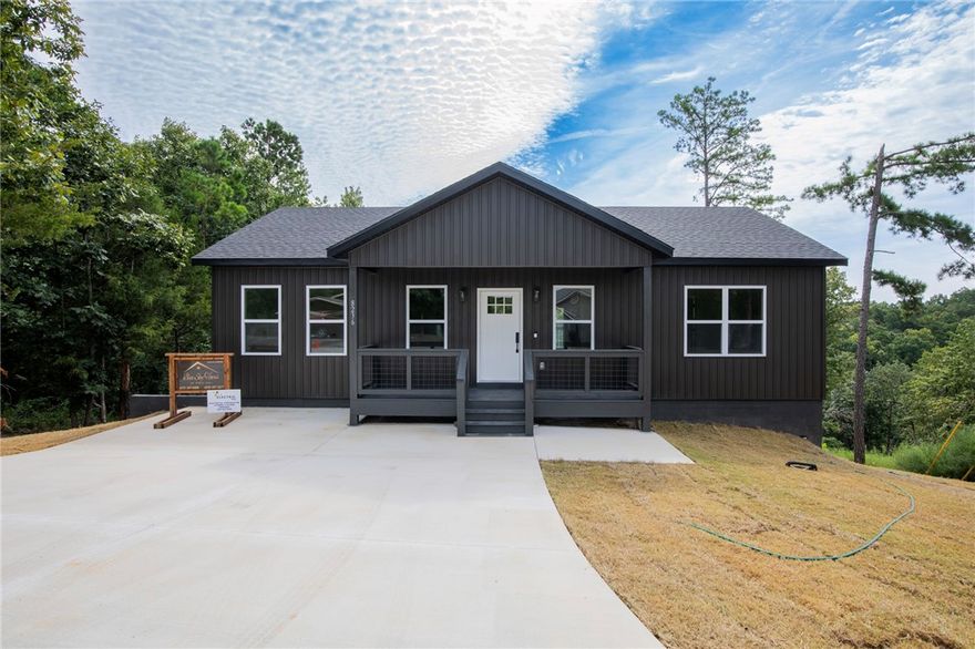 Stunning cottage minutes from Beaver Lake and Prairie Creek Marina. 2 bedroom, 2 bath semi-custom home. Walk in to your open concept living and kitchen. Large kitchen island with double the storage space underneath, and floor to ceiling custom cabinets. The primary bedroom is equipped with a lovely en suite that has custom built-in's, custom tile walk-in shower, and a double vanity. On the other side of the home is the 2nd bedroom and full bathroom. Covered back deck to enjoy nature and relax. You can be on the lake or shopping within minutes from this charmer. Downtown Rogers is within 10 minutes away.