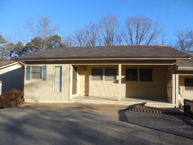 Enjoy this 3 BR 2 BA single level END unit ! Clean and ready! Tasteful neutral colors and lovely view of forest from rear deck. Large 556 sf unfinished basement area is perfect for crafts or workshop. Refrigerator included too! Not far from Bella Vista Country Club too! 2" faux blinds in bedrooms and many updated light fixtures. A very nice unit!