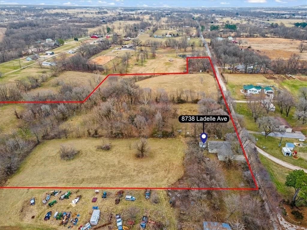This land offers 15.85 acres of partially wooded land along with a pond, and plenty of space for potential development. Or feel free to divide the land up and sell some off to help build the home of your dreams! The wide open space offers a peaceful rural feel while still being located close to town and only a 5 minute drive to nearest Harp's grocery store.