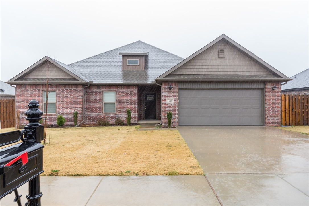 This beautiful, four-bedroom two bath home is nestled in the established Hazelton Heights Subdivision. Just minutes away from schools and downtown Bentonville. This home includes an open floorplan with plenty of entertainment space. The main living spaces includes upgraded hardwood like ceramic tile flooring with a gas fireplace. The kitchen has a walk-in pantry, gas stove, with an island as the main focal point. In the bedrooms there are walk-in closets, and the owner's suite includes a jetted tub, double granite vanities, and a custom tiled walk-in shower/spa. The backyard encompasses a covered patio with plenty of yard space for your gardening and landscaping imagination and desires.