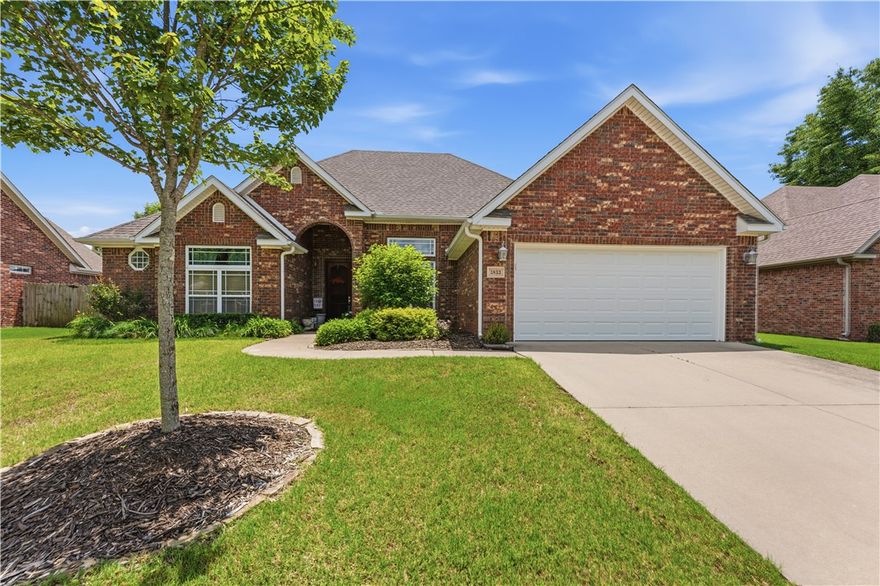 Charming all-brick single-story home with excellent curb appeal, nestled on a well-maintained lot in a quiet neighborhood. This home has so much to offer with four bedrooms and three full baths including one guest bedroom with ensuite bath. The living room and dining room have soaring ceilings. The bright kitchen has classic appeal and practical layout. Features include white cabinets with crown molding and a built-in wine rack, dark granite countertops, and a decorative diamond-tile backsplash and stainless steel appliances. A covered patio out back is perfect for quiet evenings. This home is move in ready - fridge washer and dryer convey! Schedule your showing today!