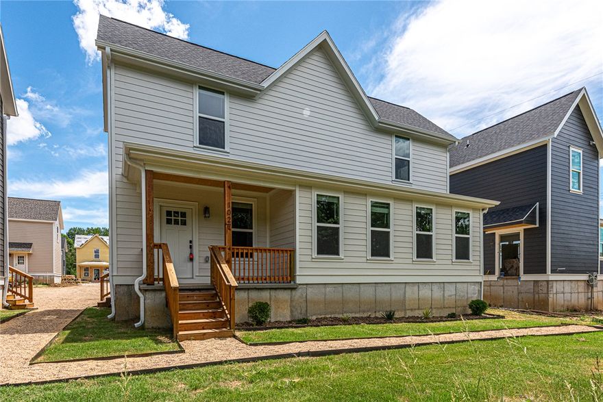 $3,500 LENDER CREDIT offered with buyer’s use of builder’s preferred lender - Use towards rate buydowns or closing costs! (OPEN HOUSES are hosted at MODEL HOME: 1015 N Laramie Heights) Welcome to Southern Woods! A Trailside Community nestled at the base of Centennial Park (2022 Top Outdoor Facility, Arkansas Parks & Rec) Not only does this location offer access to miles of trails, greenspaces with paved pathways, & bicycle stalls, it is also minutes away from shopping, food, I-49, & University of Arkansas! 3 BEDROOM CENTRAL HALL floor plan feat: a covered front porch w cedar posts, an open concept first floor w 9’ ceilings, LVP floors, & L-shaped kitchen w 3cm granite counters, subway tile backsplash, large center island w sink, stainless steel appliances & main floor primary bedroom with ensuite bathroom & laundry! Upstairs enjoy 2 more Bedrms w private ensuites! Main floor back deck! POA $35/mo includes ground maintenance, never mow again! Don’t miss out on this community in a premier location!