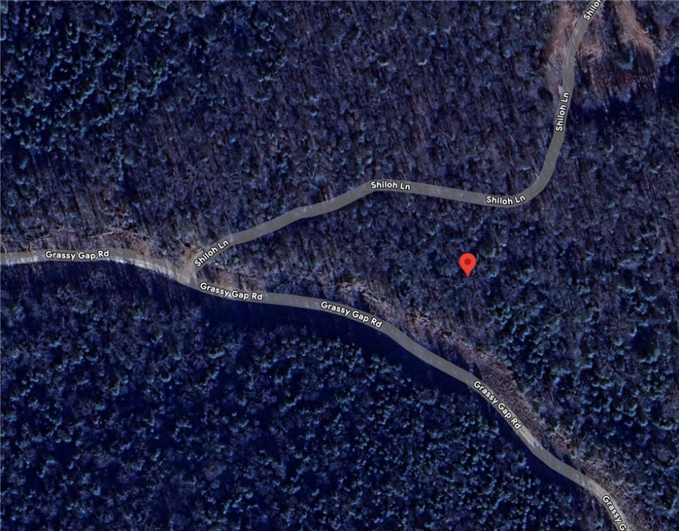 The 5.66 Acres has a great spot to build with large trees and NO restrictions. Come check it out today.