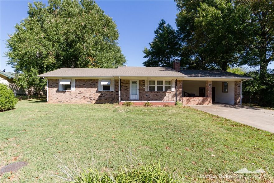 Affordable housing is hard to find, but this is it!  Great location close to everything in Pea Ridge and just steps from the Junior High School.  Beautiful fenced lot with large shade trees and outbuilding.  3 BR / 1.5 BA home with oversized laundry / pantry area off of the kitchen.  The home is full brick with windows that were updated just prior to current owner purchasing, making this an efficient choice!  Newer HVAC and woodburning fireplace in the living room.  Home has been a rental with good, long-standing tenants.  Photos are from the previous listing, but new ones will be updated soon, as not much has changed since then.  Don't miss the storm cellar in the backyard.