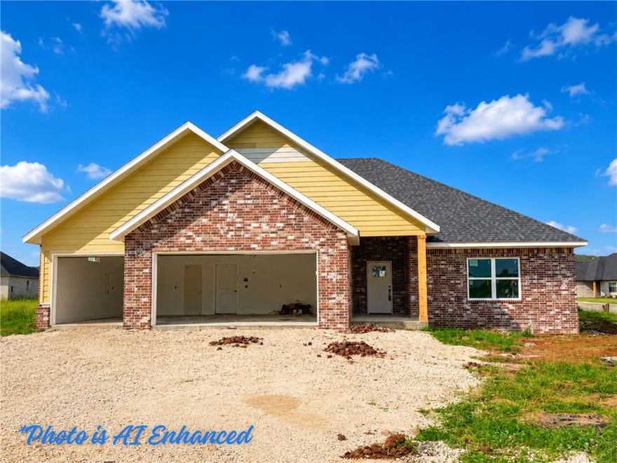 New construction home offering an open floor plan with quality finishes throughout. The spacious living area features vaulted ceilings and a cozy gas fireplace flowing seamlessly into the kitchen and dining spaces. The kitchen is highlighted by white soft-close cabinetry, quartz countertops, stainless steel appliances and a large center island with seating. Durable LVP extends through the main living areas for both style and easy maintenance. The primary suite includes a tray ceiling and an ensuite with a double vanity, quartz counters, soaking tub, fully tiled walk-in shower and a generous walk-in closet. The laundry room offers additional cabinetry and counter space. Summerfield Subdivision is just around the corner from Creekside Park, a city park with trails and recreational amenities. This home also features energy-efficient construction designed for comfort and long-term savings.