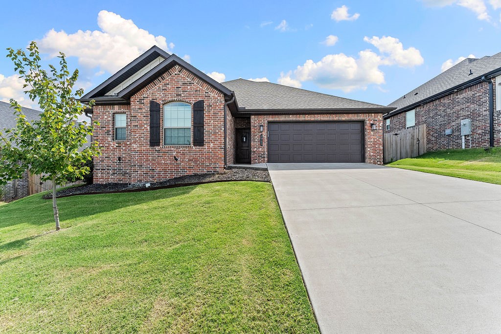Welcome Home to Osage Hills! This subdivision is conveniently located next to XNA, the Walmart DC and is located in the highly coveted Bentonville School District. This beautiful four bedroom, two bathroom home features a split floor plan, tons of storage, two car garage and covered patio with gas grill hookup. Granite countertops, to the ceiling kitchen cabinets, cabinets above the toilets, spacious bedrooms with oversized closets, custom trim and accents make this home a MUST SEE!