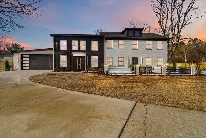 A triumph of modern design and craftsmanship, this new construction estate by Beauty4Ashes delivers an unparalleled luxury lifestyle minutes from the Walmart Campus and Bentonville’s vibrant Downtown core. A private gate leads into a formal entry courtyard with a serene modern water feature. Inside, a stunning two-story great room filled with natural light opens to a chef’s dream kitchen featuring Thermador Professional appliances, warm white oak cabinetry, premium quartz surfaces, a full-height backsplash, and an oversized waterfall island. The main-level Owner’s Wing offers a peaceful retreat with a wood-planked ceiling, spa-inspired bath, and boutique-style dressing room with center island. Upstairs includes spacious guest quarters with a private ensuite. Outdoor living shines with a resort-style deck and fireplace for year-round gatherings. Builder-ready Phase 2 plans include a pool with pool house, collector’s garage, and private in-law suite —creating a rare opportunity to expand into a true legacy estate.