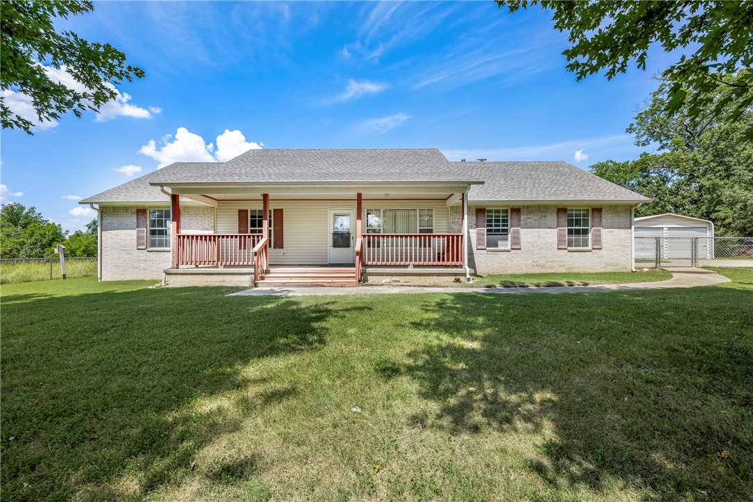 Discover the opportunity to own 7.12 acres of peaceful countryside while remaining just minutes from all that Rogers and Northwest Arkansas have to offer. This 1,717 sqft home sits on a flat, cleared portion of the property, offering an ideal blend of usable land and wooded privacy. Tucked away at the end of the road, this property provides the quiet retreat youāve been searching for. The home features a spacious sunroom ideal for off-season enjoyment and a covered front patio perfect for relaxing and taking in the natural surroundings, along with a backyard underground storm shelter for added peace of mind. A detached two-car garage with electricity & roll-up doors provides excellent storage or workshop potential. Conveniently located near Beaver Lake, downtown Rogers, and easy access to I-49, this property combines privacy with accessibility, making it a truly unique find in Northwest Arkansas.