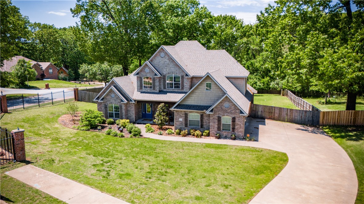 This beautiful 4-bed, 3.5-bath home has 3,637 sqft of living space, perfect for growing families or those who love to entertain. Situated on a huge corner lot, you'll enjoy ample outdoor space and privacy in your fenced-in backyard. Many recent updates have been made to the home. Located on 8th Street, you're just a stone's throw away from trails, parks, and the Walmart Home Office—ideal for those who appreciate convenience and connectivity. Inside, you'll find a perfect blend of comfort and elegance, with carpeted bedrooms for cozy relaxation and tile and hardwood floors adding timeless charm to the rest of the home. Don't miss out on this fantastic opportunity to call Bentonville home—schedule your showing today!