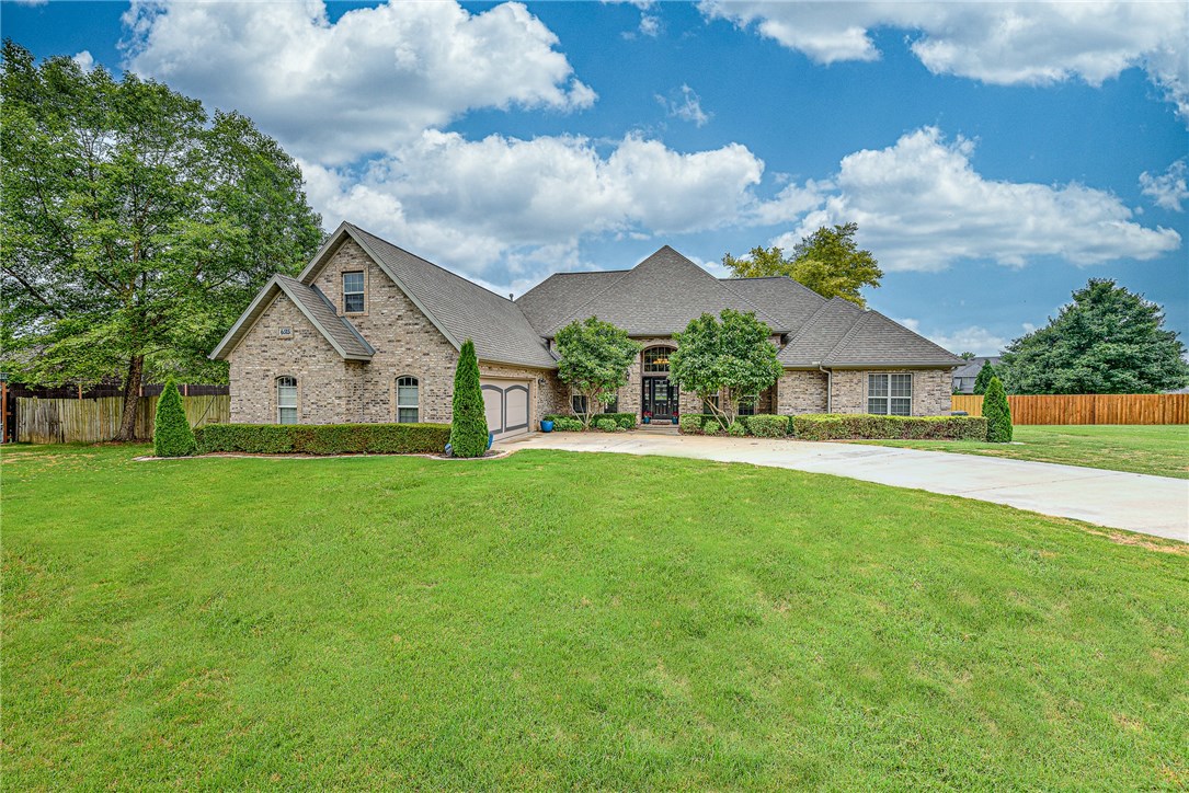 Luxury living on almost 1 acre in the lush countryside of Springdale.? Enjoy entertaining friends and family in the large backyard with a beautiful with mature trees or cozied up on the partially covered patio. Step inside to a bright open floor plan that provides lovely hardwood flooring, white cabinetry and moulding, creamy granite, intricate light fixtures, a grand fireplace and fantastic views from all the windows. This outstanding property is perfectly located within 3 miles of Arvest Ballpark, Arkansas Children’s Hospital, Fayetteville Medical District and I-49, making trips to Bentonville or Fayetteville quick and easy. Welcome Home.