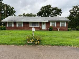 LOCATED IN A QUIET AREA/ CUL DE SAC-- this BEAUTIFUL BRICK DWELLING is impeccable! Offers a well kept lawn, extra acreage, cute outbuilding. Meticulous and updated throughout---absolutely gorgeous! New flooring, new doors, new paint, completely remodeled bathrooms! Granite countertops in kitchen and baths. Spacious primary suite, and the cutest kitchen with savvy, built in shelves. ALL APPLIANCES CONVEY! Patio overlooks the vast back lawn, partially wooded. This exceptional opportunity is now available!