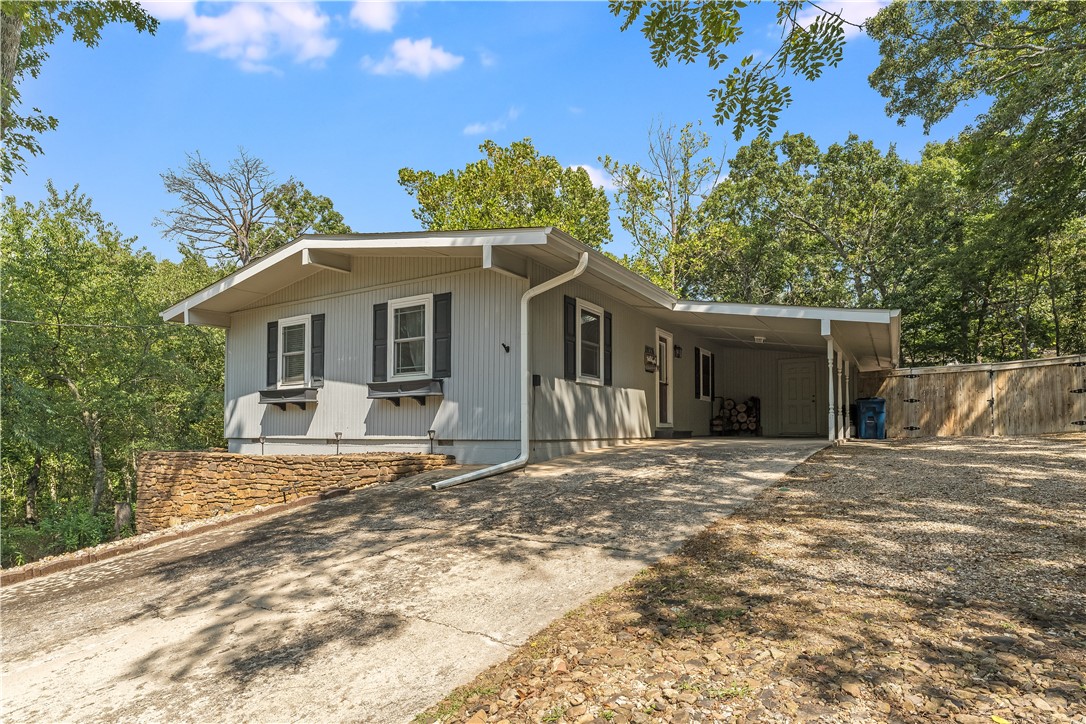Discover a beautifully updated cottage in the woods with modern finishes and a serene Bella Vista setting. The kitchen has been completely renovated with new flooring, cabinetry, countertops, and appliances. Additional updates over the last 5 years include a new roof and chimney, updated carpet, and a fully remodeled bathroom. Enjoy the landscaped surroundings from the screened-in porch almost year-round. Extra storage is available under the house and in the backyard shedāperfect for bikes and outdoor gear. Less than half a mile to the Back 40 Trailhead at Blowing Springs, this home offers quick access to Bella Vistaās renowned trail system while keeping you tucked away in a quiet, wooded location. Ideal for a primary residence, weekend retreat, or investment property.