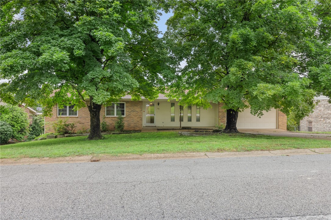 Discover this 4BR, 2.5 BA home with versatile living spaces. The main level features 3 BR, including 1.5 BA, a kitchen/dining combo, a den, and living room. An attached 2-car garage adds convenience. Enjoy the covered deck's view. The basement offers a private 1BR, 1BA with a family room and a large workshop/storage area. Conveniently close to schools and downtown. Don't miss this opportunity to make it yours!