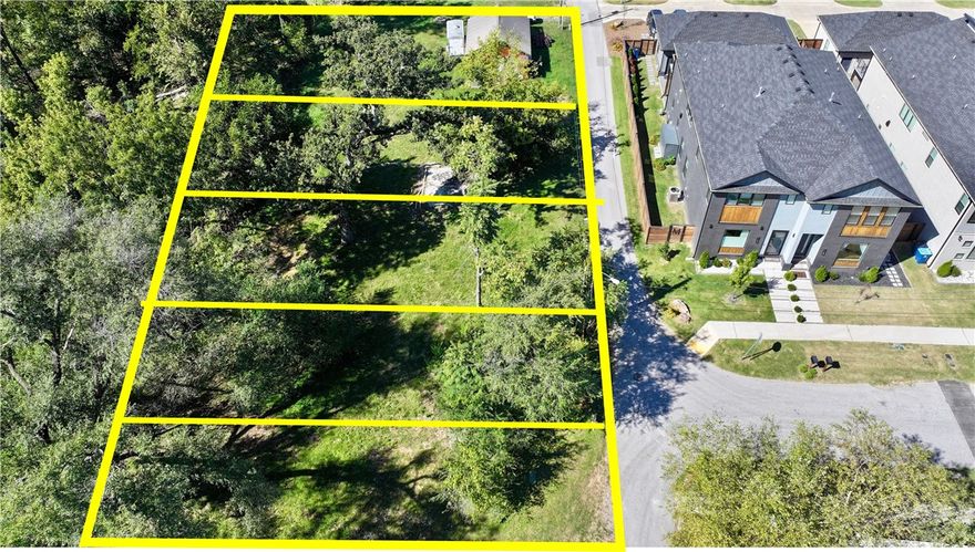 Ready for your Next Home and more! Situated on 3 platted lots and rezoned DN-2, this beautiful downtown parcel is a developers dream and, when combined, can be split  into 5  lots. Buy one lot and build your dream home with an ADU or a duplex for income generating potential, or buy them all and let your imagination run wild in a quickly appreciating neighborhood. With 3 major trailheads and new Skybridge just down the street, within minutes you can walk or bike to the Bentonville Square, Crystal Bridges, Park Springs Park, the Razorback Greenway & Slaughter Pen bike trails and enjoy all the best of Downtown Bentonville, all while enjoying a quick 10 minute commute to the new WM Campus